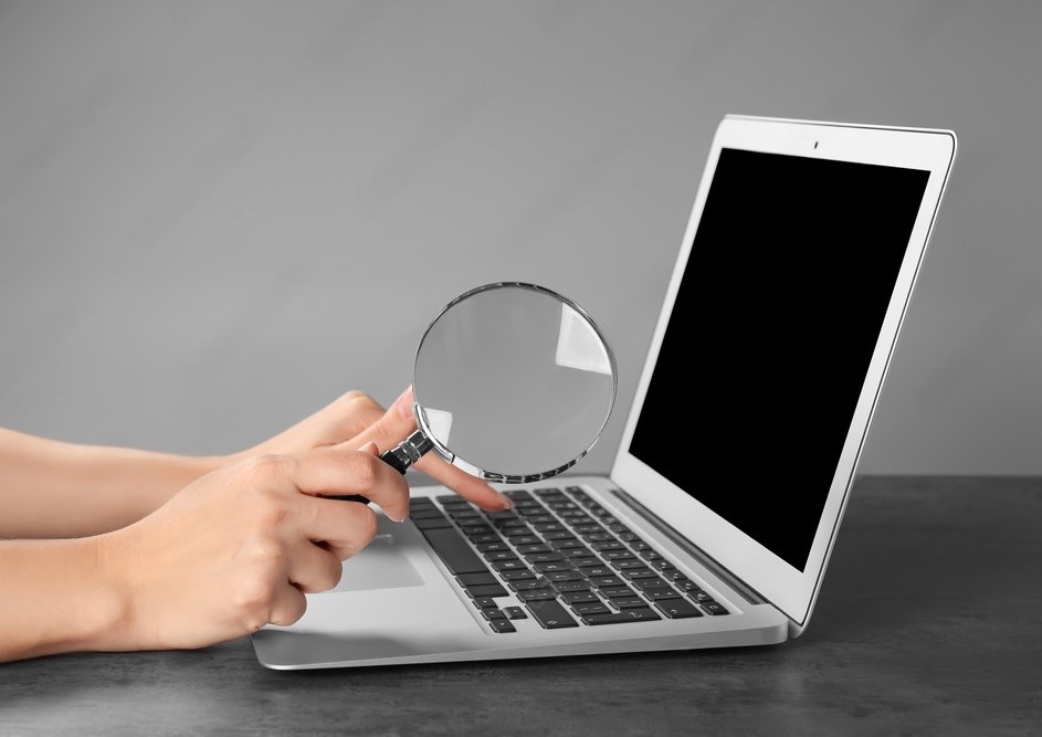 magnifying glass over computer