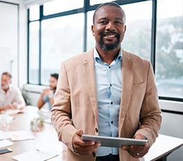 a black minority female entrepreneur with a tablet
